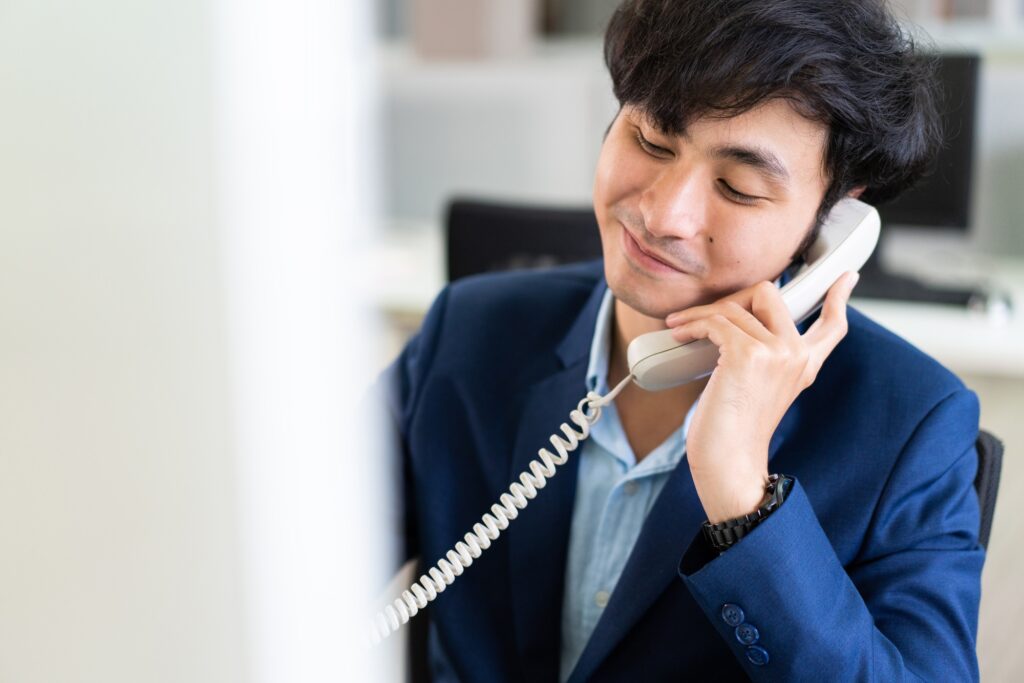 Male financial advisor talking on the phone with customer